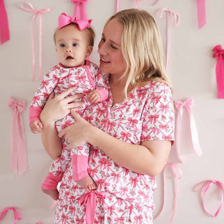 Newborn baby onesie and mom matching pink bow pajama set for family