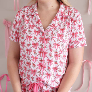 White two piece pajama set with pink bow floral print and chest pocket