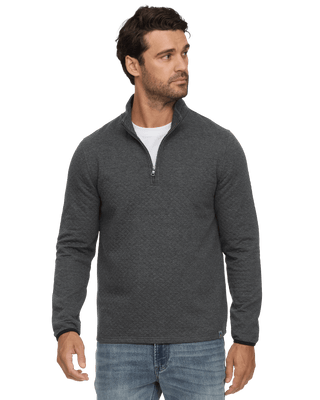 Man wearing Flag Bradner charcoal heather quilted quarter-zip mock neck pullover with jeans