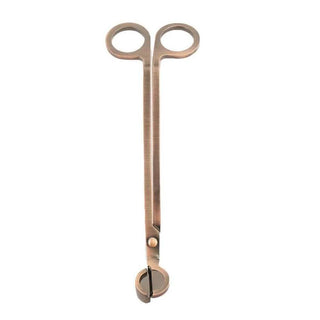 Brushed gold wick trimmer with matte metal finish and circular loops for trimming candle wicks