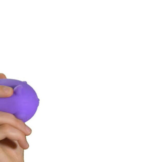 Hands squeezing a purple Cool Cats Nee Doh stress ball toy against white background