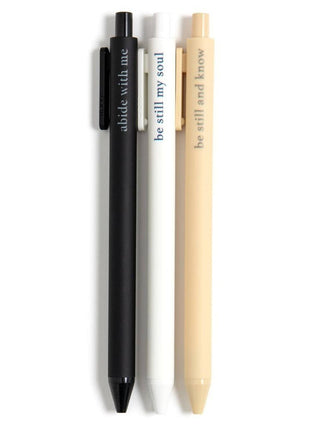 Three-pen set in black, white, and beige with inspirational phrases printed on each pen