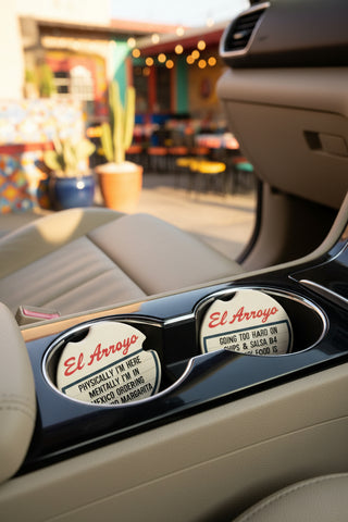 El Arroyo set of two round car coasters with humorous Mexican restaurant-themed text messages
