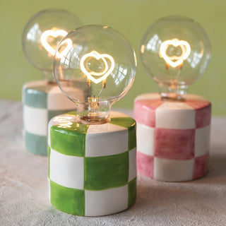 Decorative lamps with checkered bases and heart-shaped light bulbs