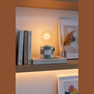 Checkered Ceramic LED Light on living room shelf with books and decor