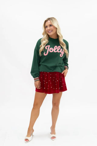 Green chenille Jolly graphic sweatshirt with pink script lettering and striped cuffs