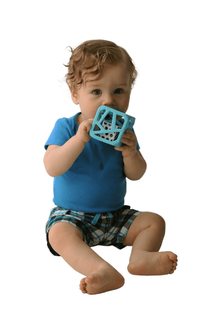 Baby gripping light blue Malarkey Kids teething rattle cube with geometric openings and tactile surface