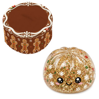 Gold glitter Christmas dumpling squishie toy with gingerbread tin box