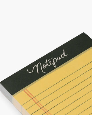Close-up detail of Rifle Paper Co. Class Notes Notepad showing yellow lined pages and black header