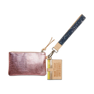 Pink metallic pouch with a keychain and small book 