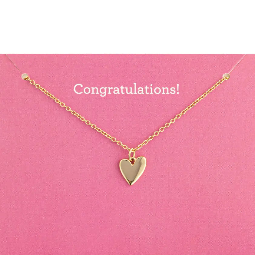 Gold heart necklace on a pink background with 'Congratulations!' text