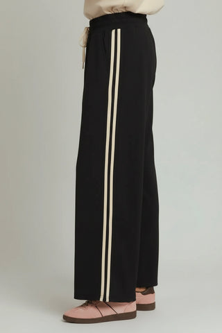 Black wide-leg pants with cream double side stripes and drawstring waist