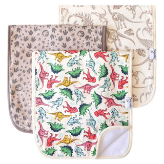 Dinosaur themed baby burp cloths with colorful dinos and fossils on cream background