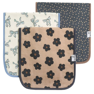 Copper Pearl set of three cotton burp cloths with floral, bow, and polka dot patterns and fleece backing