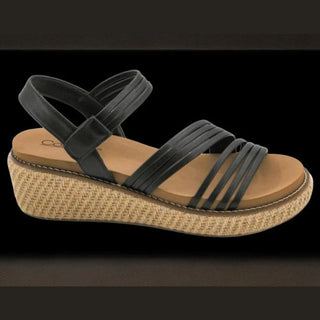 Black wedge sandal with a woven sole 