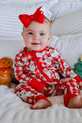 Baby girl wearing red plaid Santa Claus print zipper romper with matching red bow headband