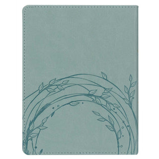 Close-up of dusty teal pebbled faux leather texture on back cover of Daily Hope for the Empty Nest devotional