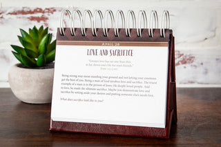 Burgundy spiral desktop perpetual calendar open to April 28 Love and Sacrifice devotional page
