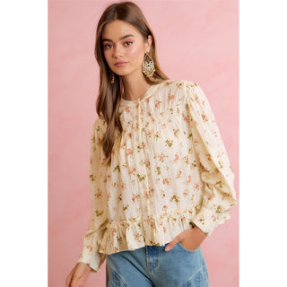 Cream long-sleeve floral peplum blouse with ruffle hem and pintuck details