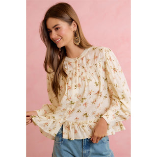 Cream long-sleeve floral peplum blouse with ruffle hem and pintuck details