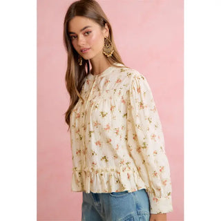Cream long-sleeve floral peplum blouse with pink rose print and ruffle hem