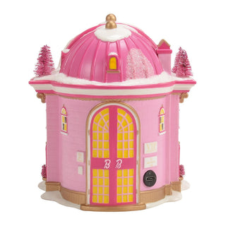 Pink Barbie-themed decorative house with dome roof and yellow lit windows on white background