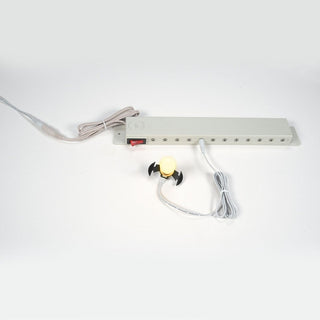 Department 56 village lighting system with power strip, red switch, and decorative bulb attachment