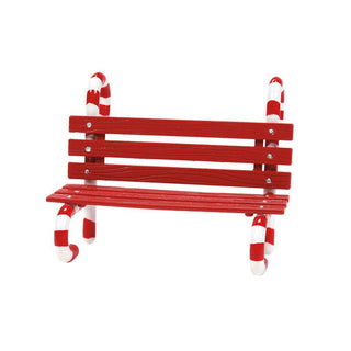 Red wooden miniature bench with candy cane striped legs on white background