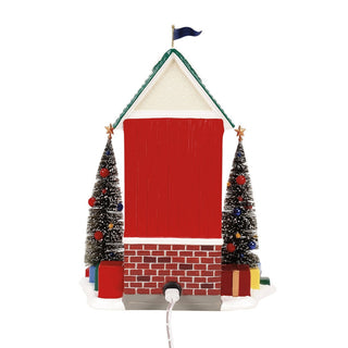 Department 56 Snowvil Sentry lighted building with decorated Christmas trees and gift boxes