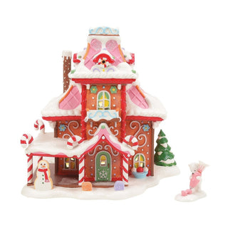 Department 56 gingerbread-style Christmas village house with candy cane decorations and snow details