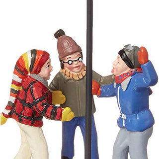 Department 56 Triple Dog Dare figurine set with three children around a metal pole in winter clothing