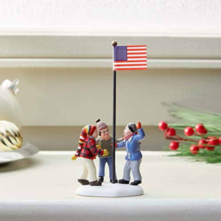 Department 56 Triple Dog Dare figurine with three children around American flag pole