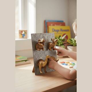 Dinosaur Magnets being played with by child on magnetic board