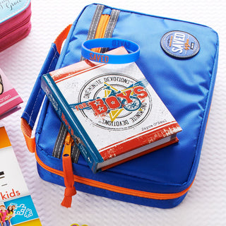 Blue pencil case with books and a blue bandana on a white surface