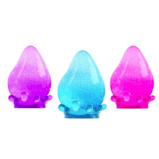 Three glittery Nee Doh Dream Drop stress balls in purple, blue, and pink