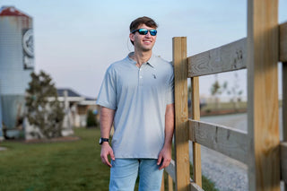 Men's Edisto Polo in dark slate gray with white stripes, athletic fit, embroidered dog and moon logo on chest