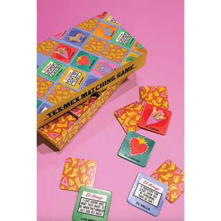 El Arroyo Tex-Mex Matching Game box with colorful lotería-style cards spread on pink background