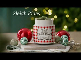 Candle Warmers Sleigh Rides electric wax warmer with red gingham pattern surrounded by holiday ornaments
