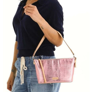 Person holding a pink handbag