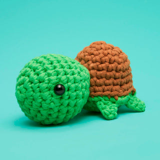 Woobles Emilio the Turtle crochet amigurumi toy with green body and brown shell