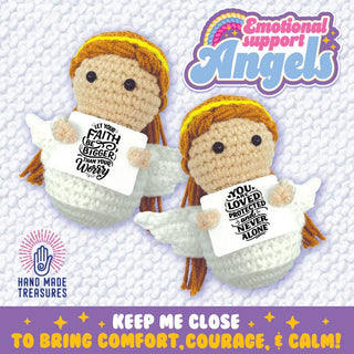 Two crocheted angel dolls with auburn hair, halos, wings, holding inspirational cards