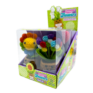 Crocheted emotional support flower figurines in colorful yarn, displayed in clear gift boxes