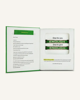 We Are Enough ENOUGH beaded leather bracelet set in green, shown in book-style gift packaging with poem