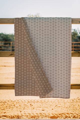 Ida Mae EB Chesnut Garden Brown Quilt draped over wooden fence rail showing both sides