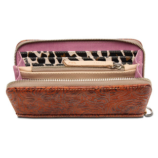 Open Consuela Essential Wallet in Banks showing tooled brown leather exterior and purple interior with animal print card s...