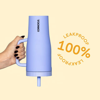 Corkcicle 22oz Cruiser tumbler in periwinkle blue held upside down, leakproof badge