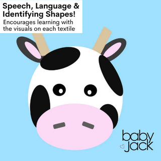 Illustration of cartoon cow face on blue fabric encouraging speech and shape learning