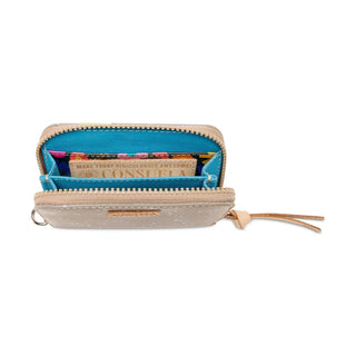 Open beige wallet with blue interior showing cards and a strap