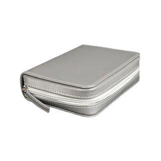 Vibrant fuchsia vegan leather tool case with contrasting silver zipper emphasizing bold color and portability