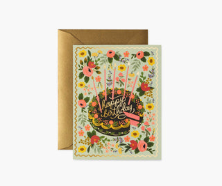 Rifle Paper Co. floral birthday card with chocolate cake, pink candles, and gold envelope